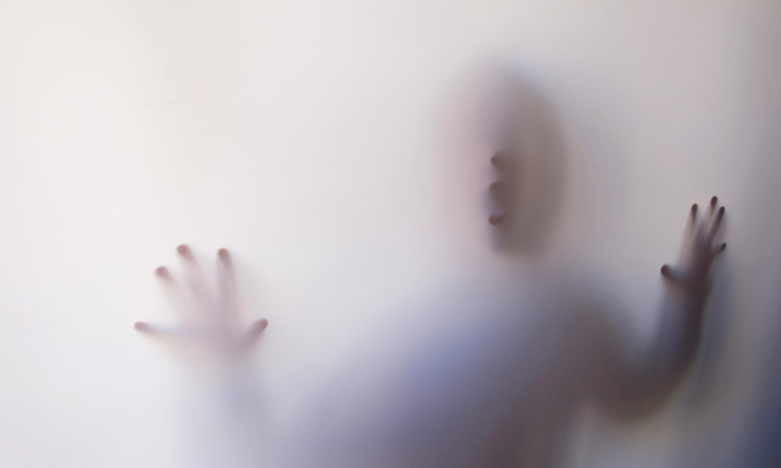 pexels-photo-626164-626164 Eerie silhouette of a person pressing against a white curtain, creating a mysterious atmosphere.